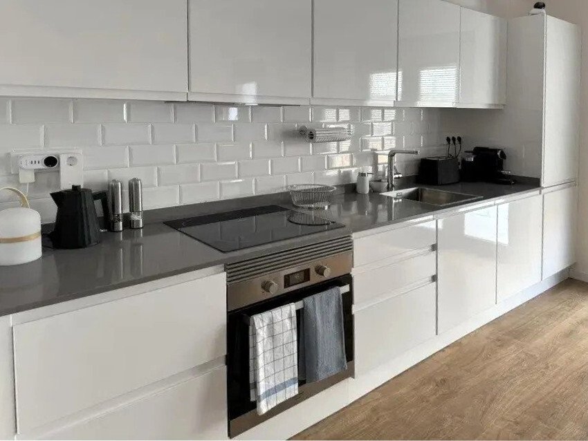 Modern kitchen with well-designed workflow and high-quality built-in equipment Modern kitchen with well-designed workflow and high-quality built-in equipment