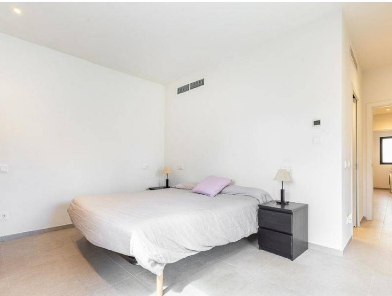 Comfortable bedroom with modern air conditioning and optimal space utilization