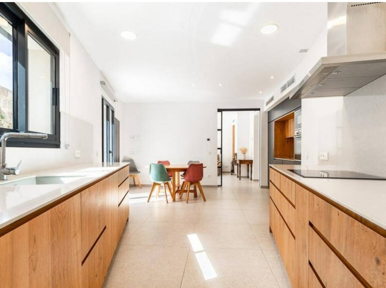 Modern open-plan kitchen with professional equipment