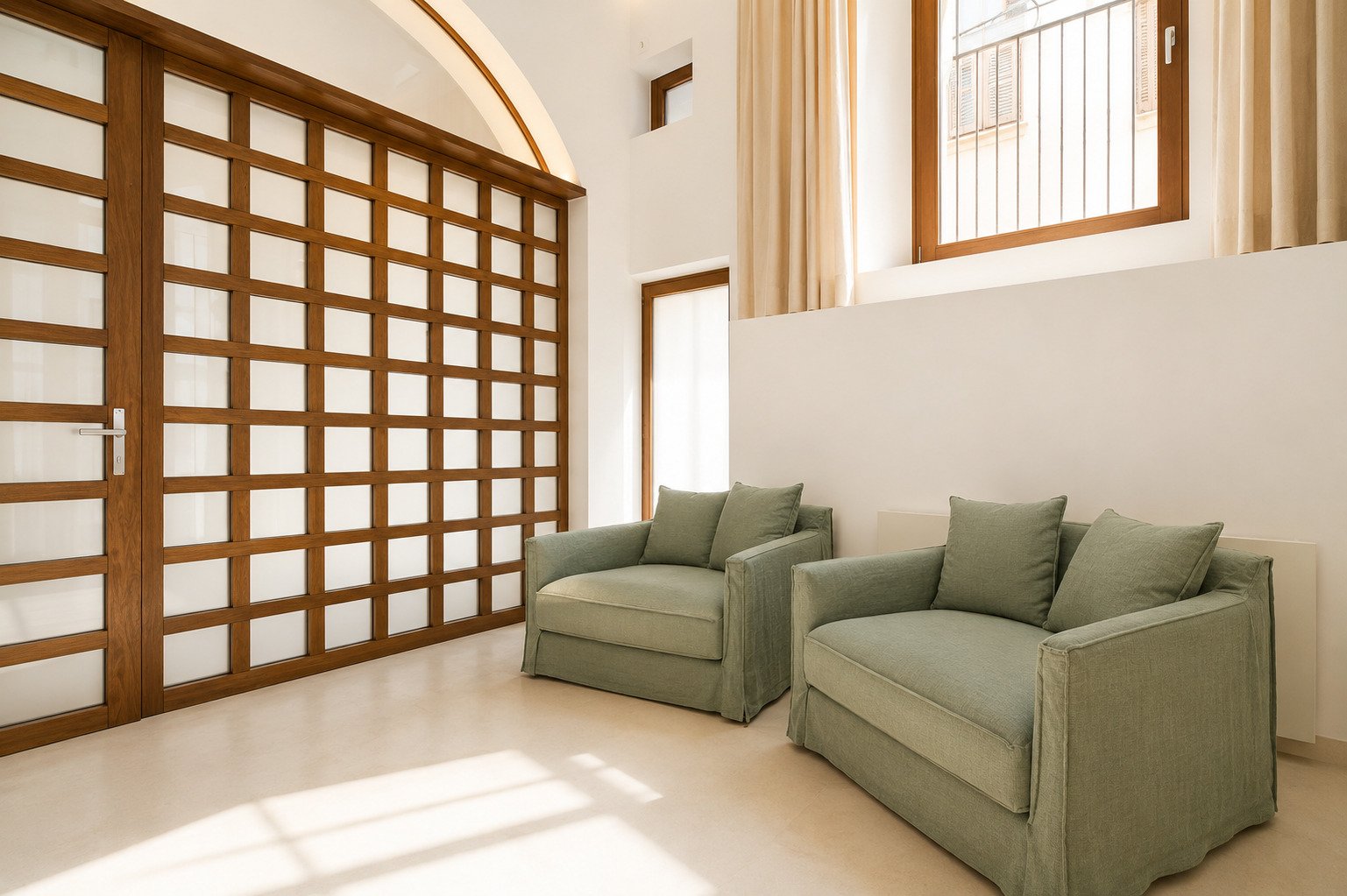 Bright living area with floor-to-ceiling windows and elegant sliding doors Bright living area with floor-to-ceiling windows and elegant sliding doors