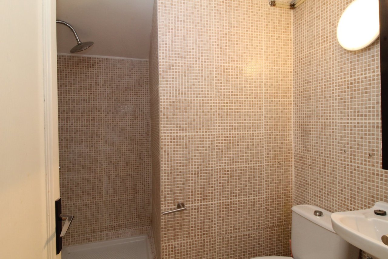 Modern shower bathroom with high-quality mosaic cladding and practical features Modern shower bathroom with high-quality mosaic cladding and practical features