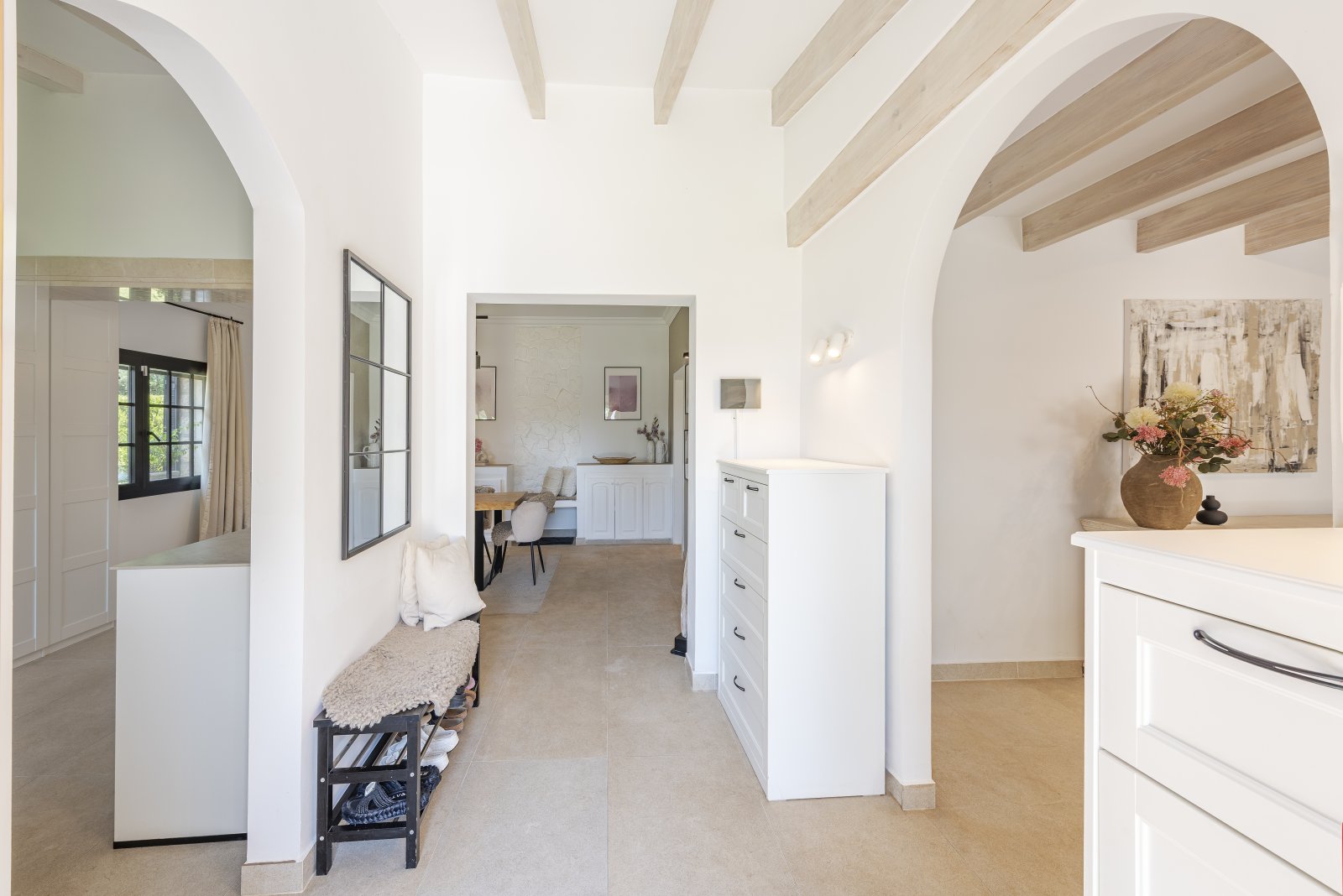 Open floor plan with distinctive wooden beams and functional layout Open floor plan with distinctive wooden beams and functional layout
