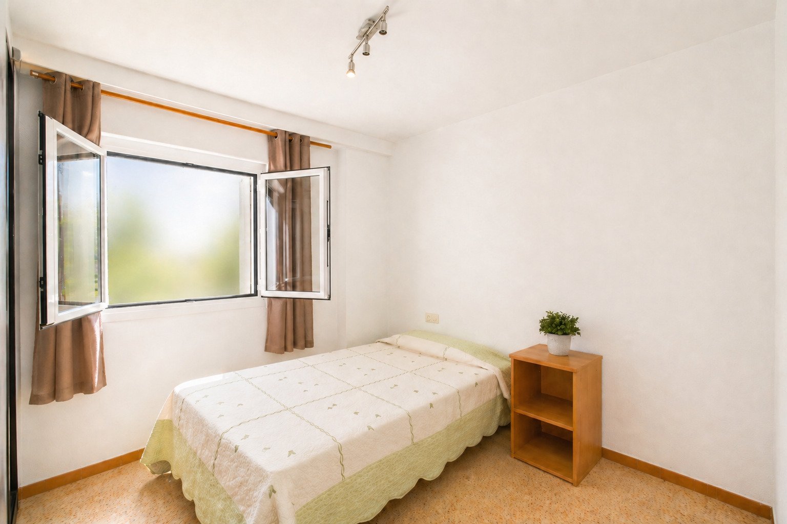 Bright bedroom with large window front and optimal lighting Bright bedroom with large window front and optimal lighting