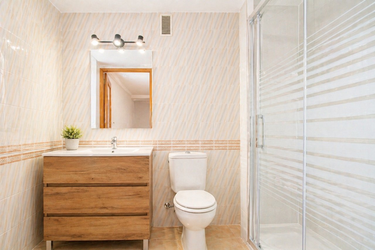 Modern bathroom with walk-in shower and practical washbasin unit Modern bathroom with walk-in shower and practical washbasin unit