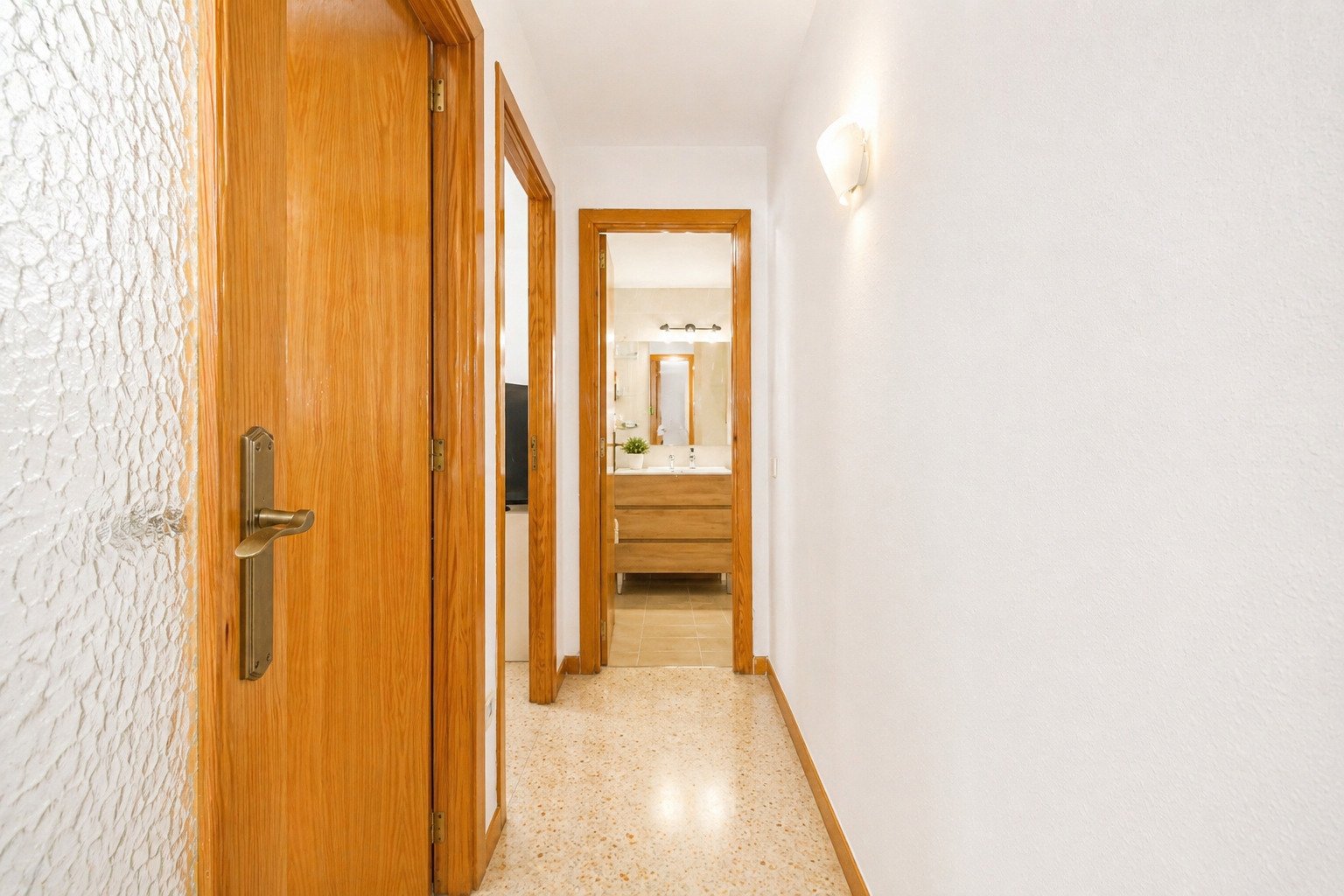 Elegant hallway area with practical space access and high-quality wooden doors Elegant hallway area with practical space access and high-quality wooden doors