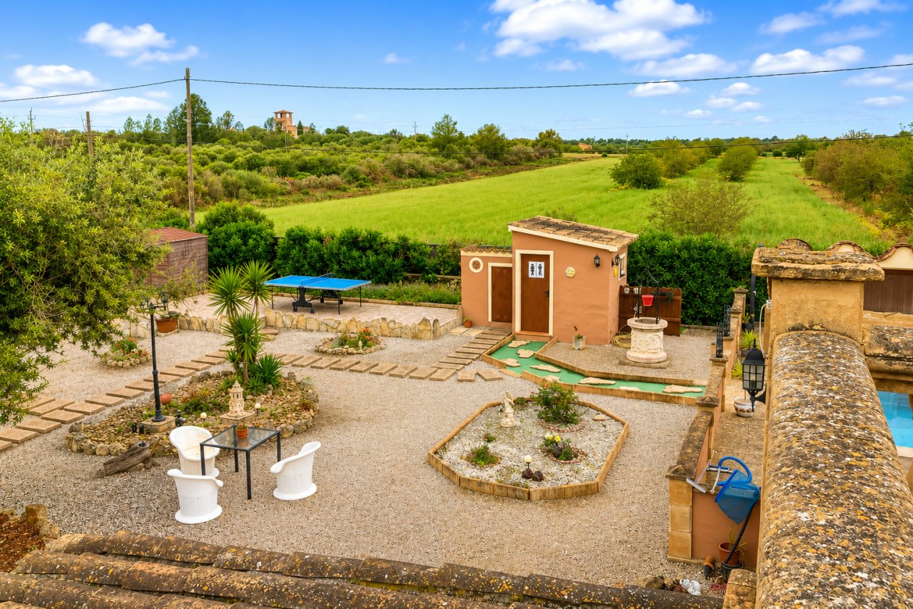Versatile outdoor area with recreational facilities and open garden design