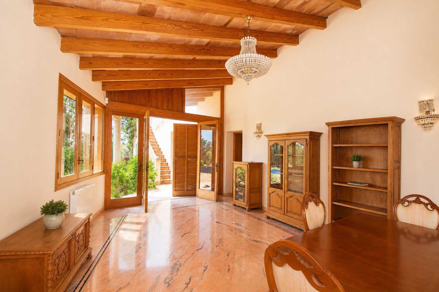 Elegant living space with exposed wooden beams and versatile room usage Elegant living space with exposed wooden beams and versatile room usage