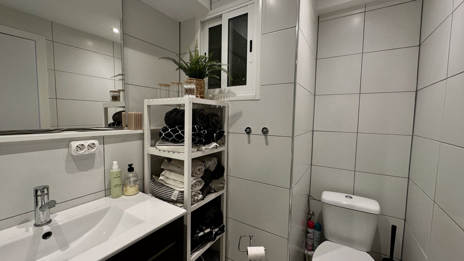 Modern bathroom with practical storage solution and high-quality sanitary fittings