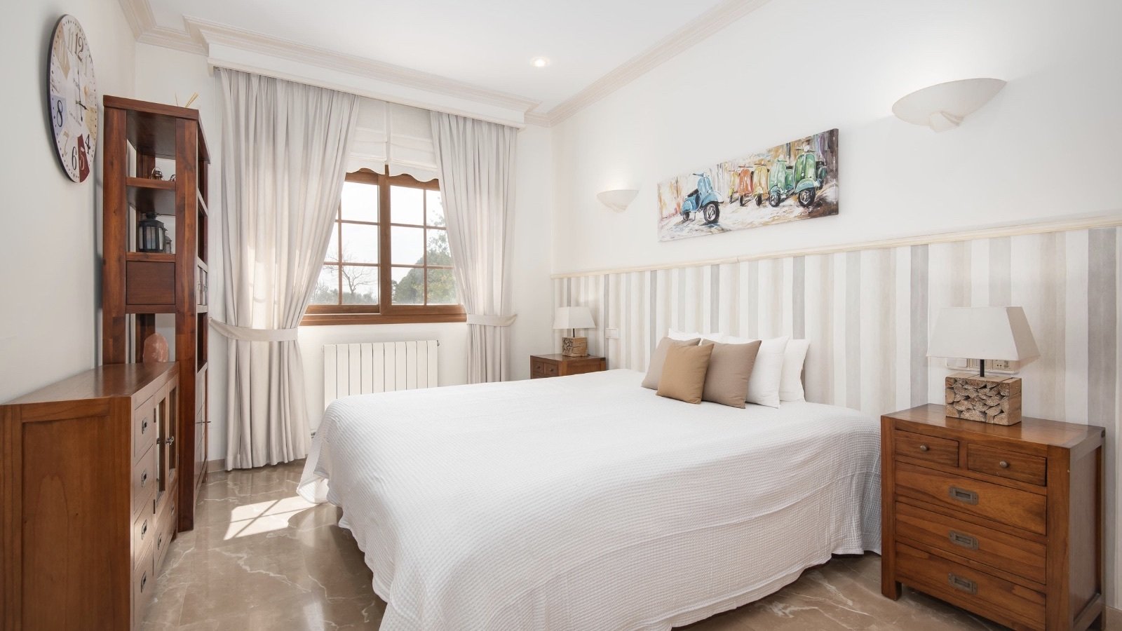 Bright master bedroom with floor-to-ceiling windows, heating system, and well-designed layout