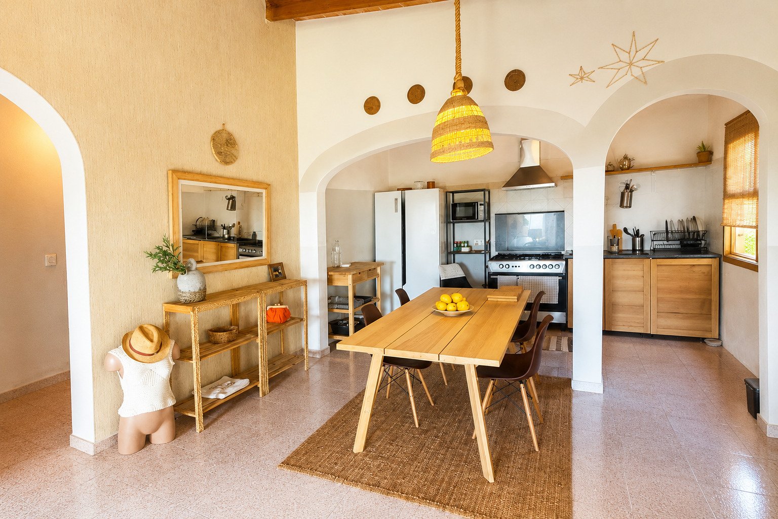 Open kitchen with elegant arch openings and high-quality kitchen equipment