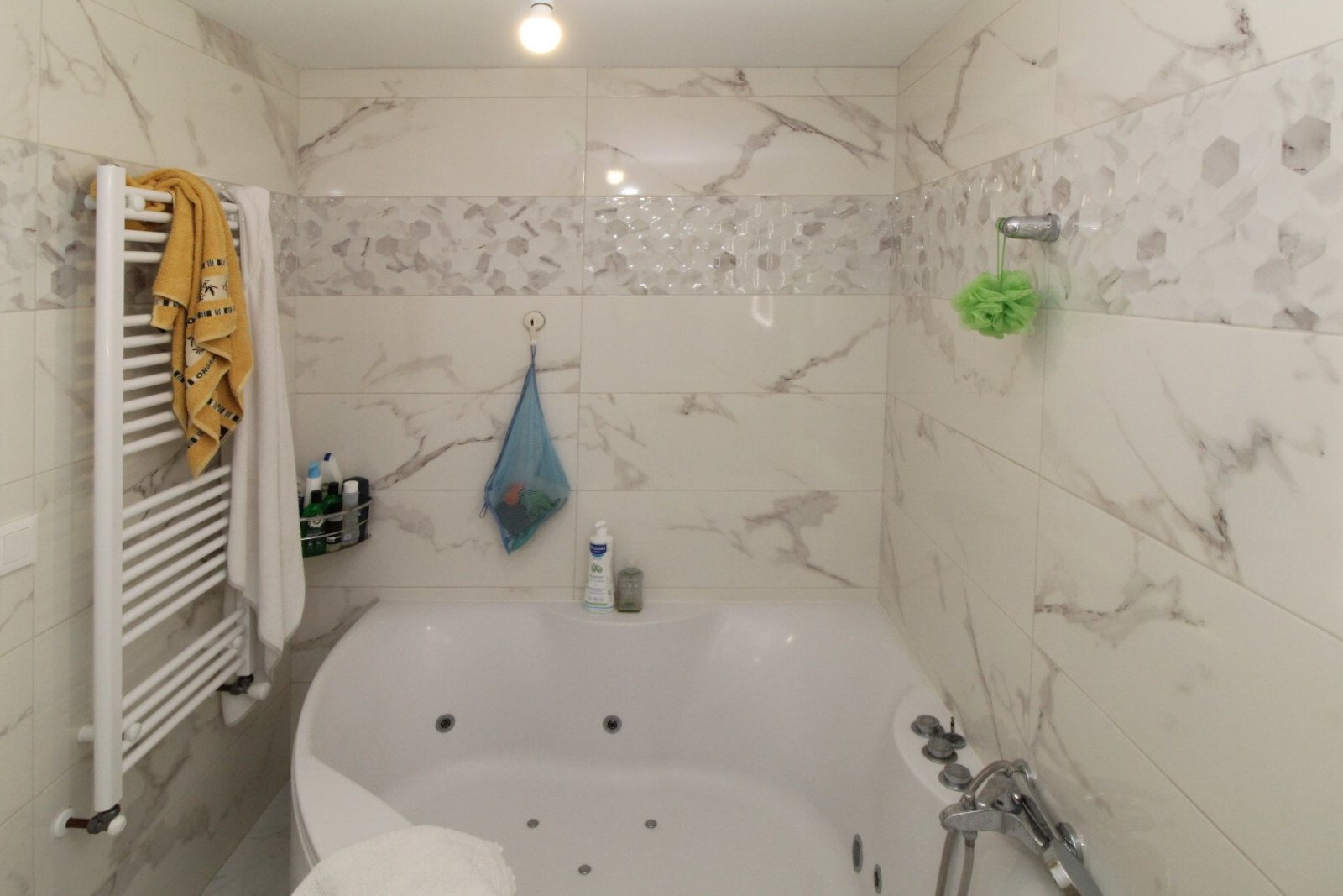 Luxurious bathroom with whirlpool tub and elegant marble design Luxurious bathroom with whirlpool tub and elegant marble design