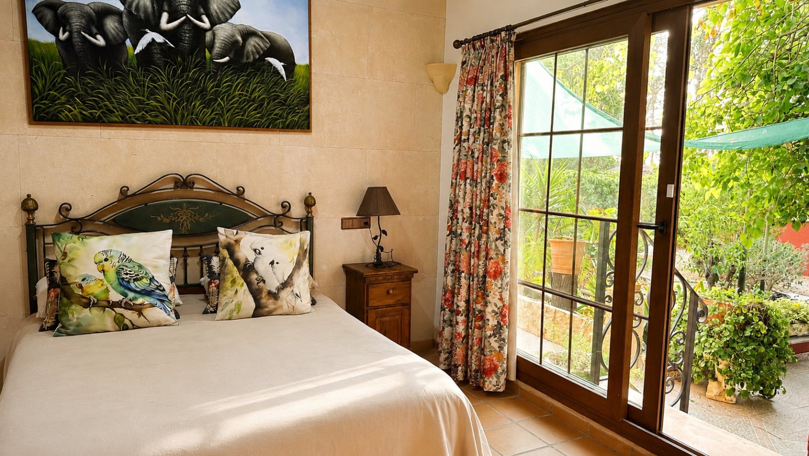 Elegant bedroom with direct terrace access and high-quality tiled flooring Elegant bedroom with direct terrace access and high-quality tiled flooring