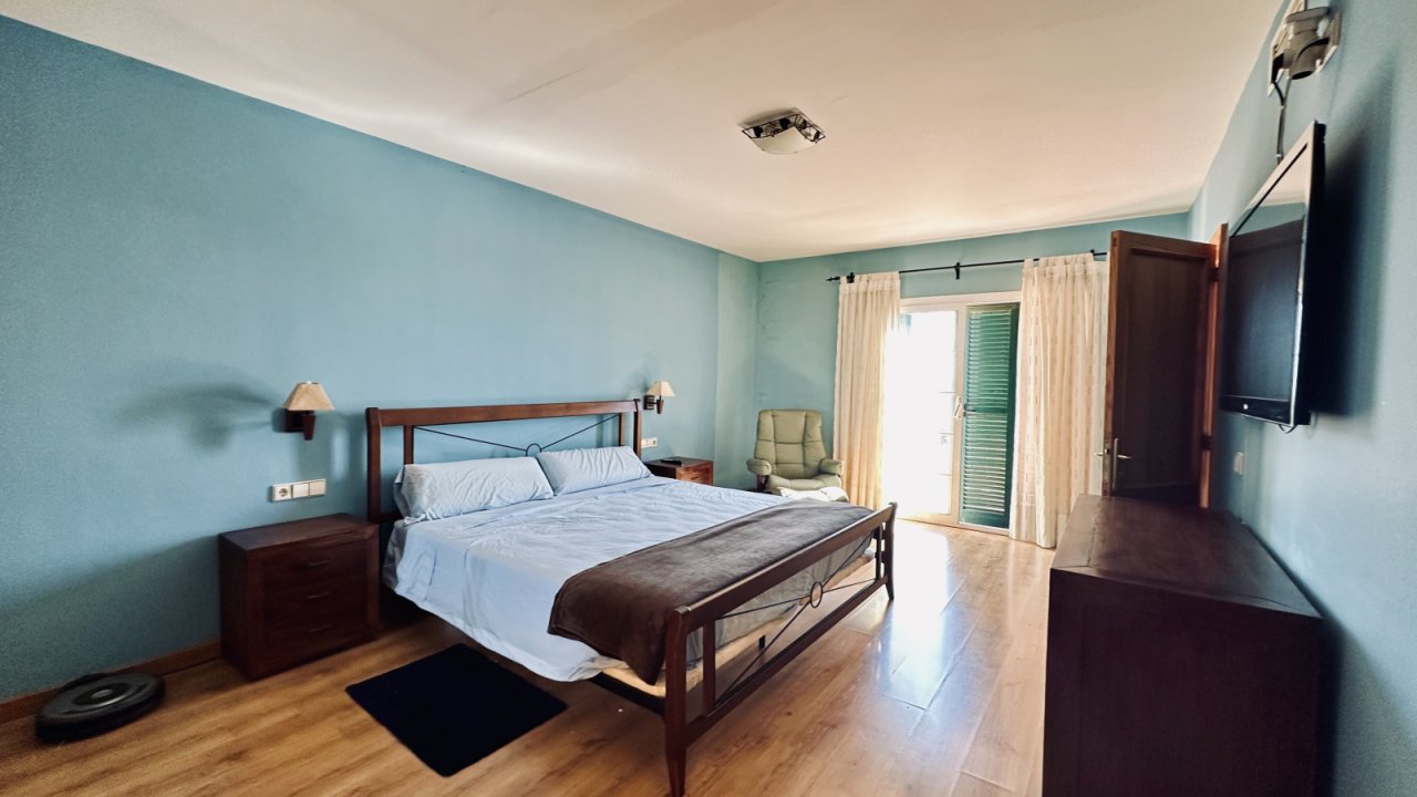 Comfortable master bedroom with direct terrace access and high-quality furnishings Comfortable master bedroom with direct terrace access and high-quality furnishings