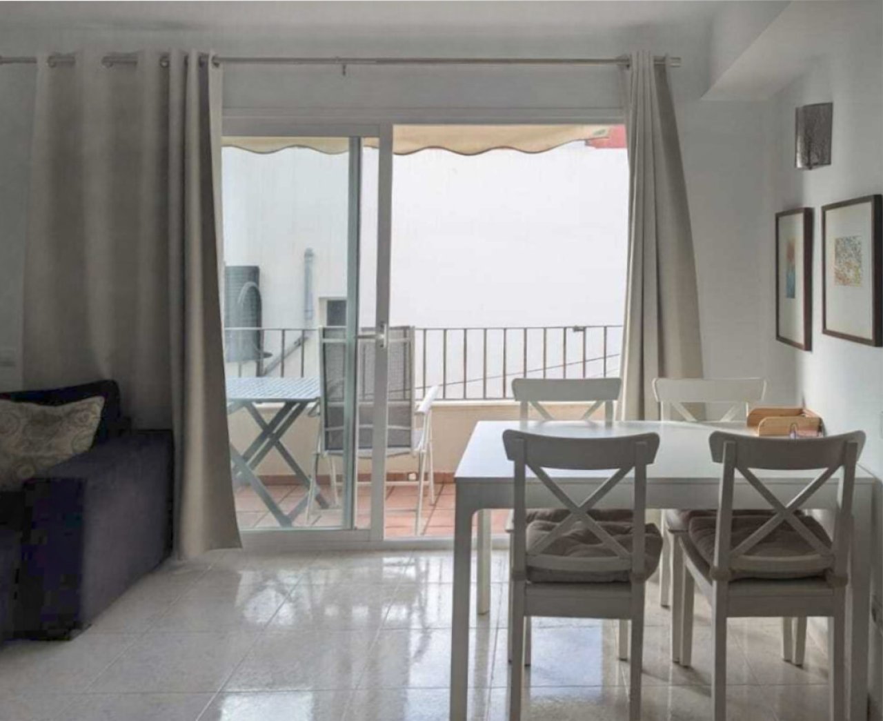 Living and dining area with large glass sliding doors and sea view terrace Living and dining area with large glass sliding doors and sea view terrace