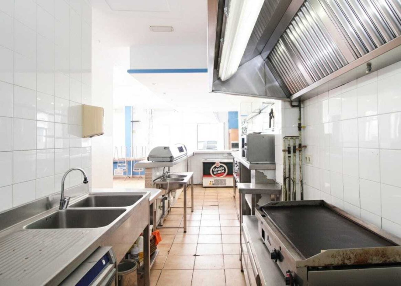 Professional large-scale kitchen line with high-quality equipment and optimized workflow Professional large-scale kitchen line with high-quality equipment and optimized workflow