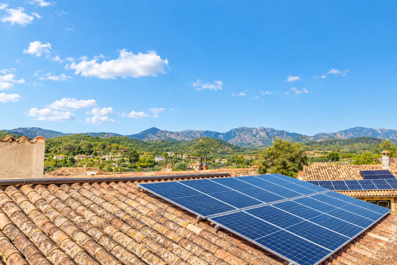 Solar system on the roof with stunning mountain views and picturesque scenery Solar system on the roof with stunning mountain views and picturesque scenery
