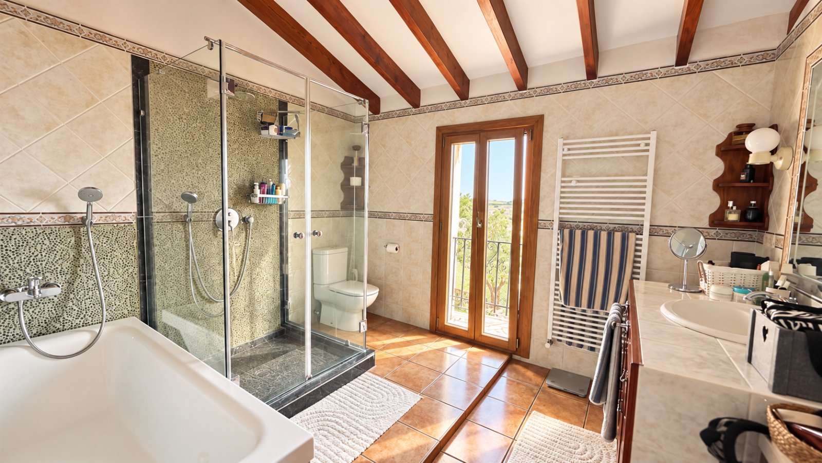 High-quality bathroom with a well-designed layout, modern shower units, and access to the balcony.