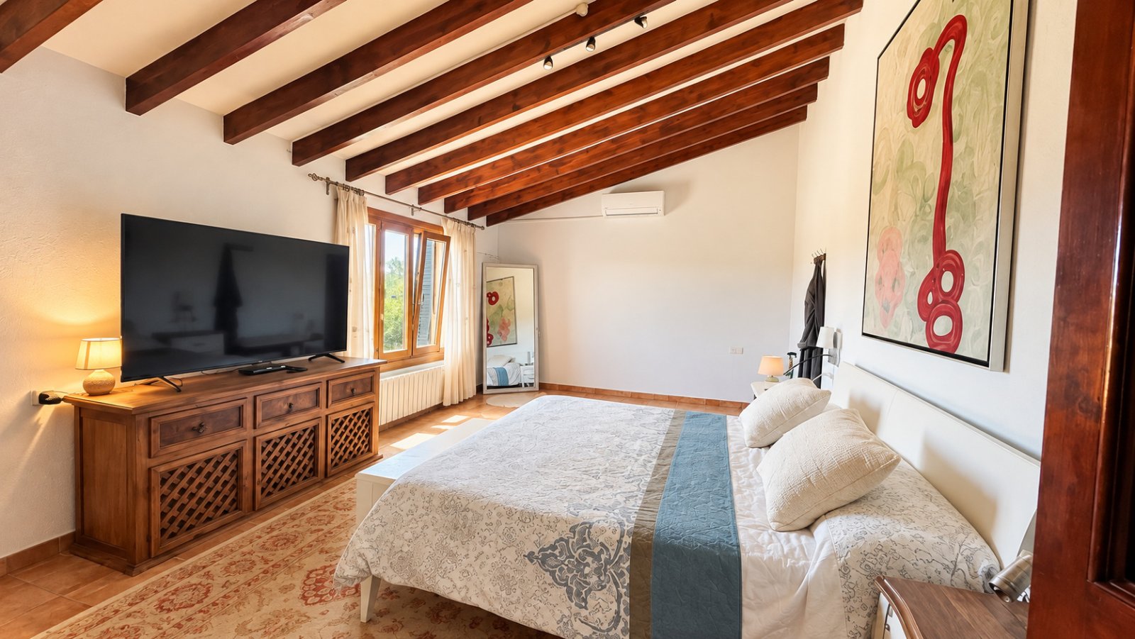Cozy bedroom with well-thought-out layout and high-quality fixtures