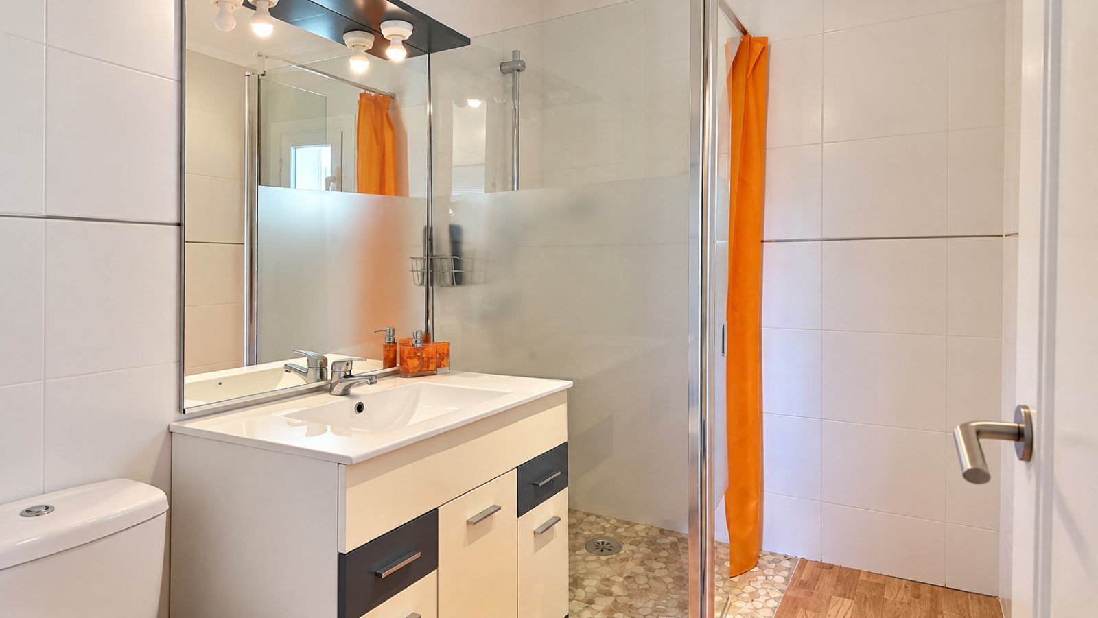 Modern bathroom with walk-in shower and practical vanity cabinet Modern bathroom with walk-in shower and practical vanity cabinet