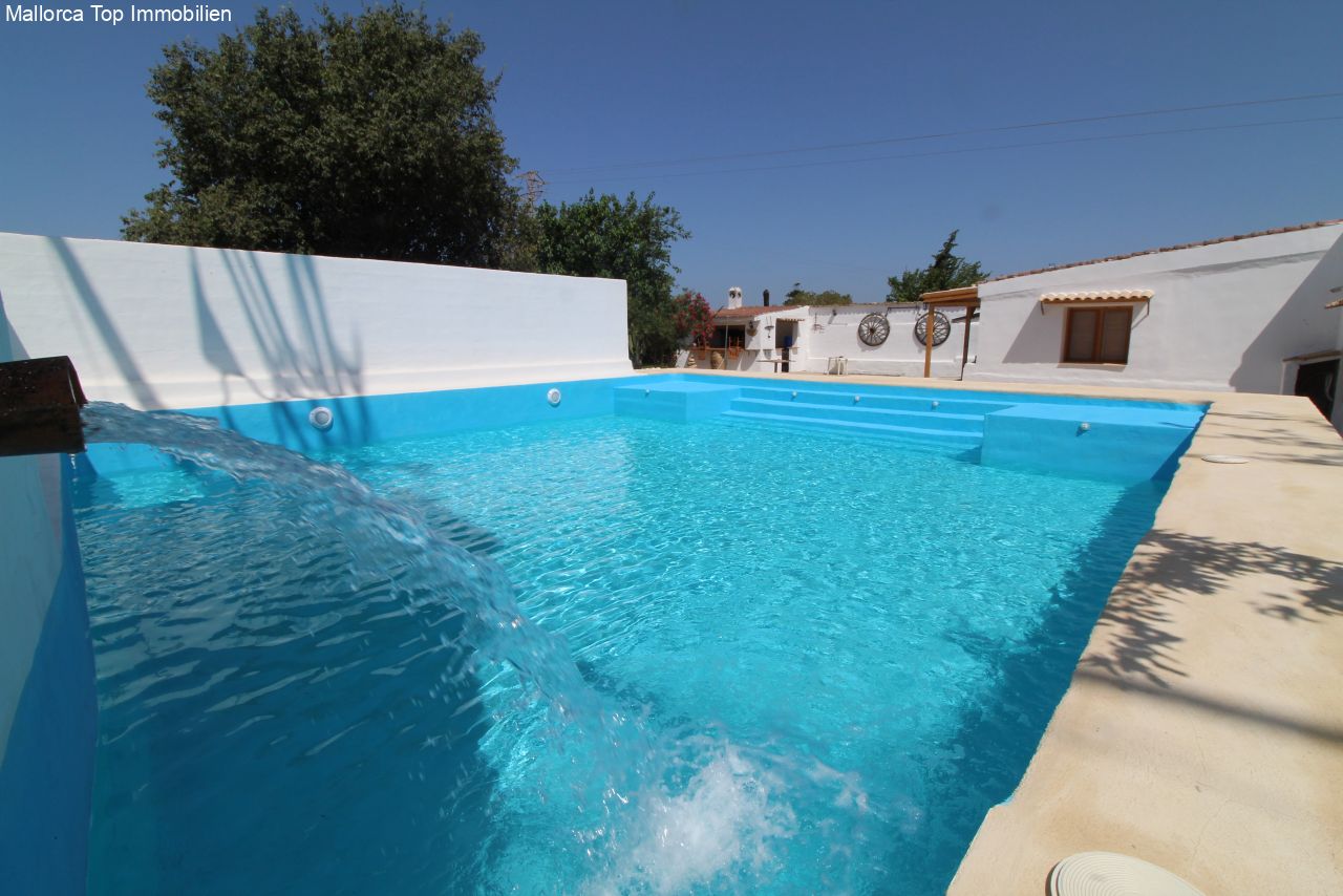Sun-soaked pool area with spacious lounging space and professional fountain features Sun-soaked pool area with spacious lounging space and professional fountain features