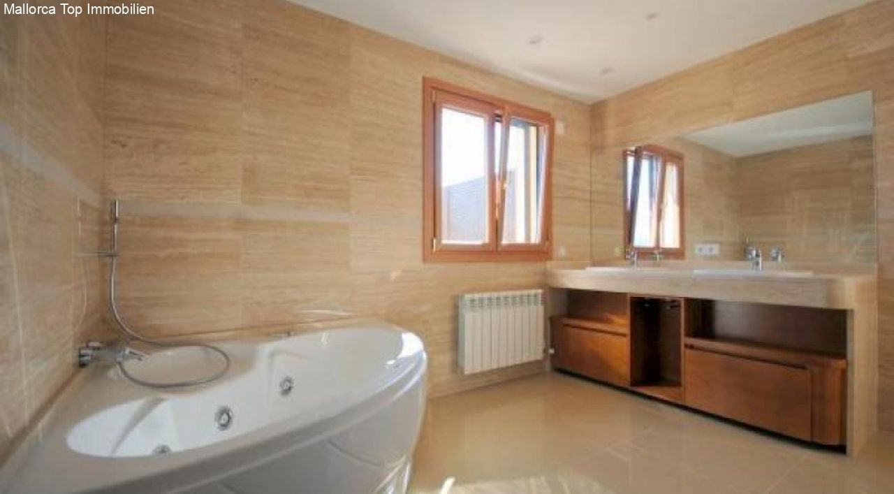 Luxurious spa bathroom with whirlpool tub and large double vanity Luxurious spa bathroom with whirlpool tub and large double vanity