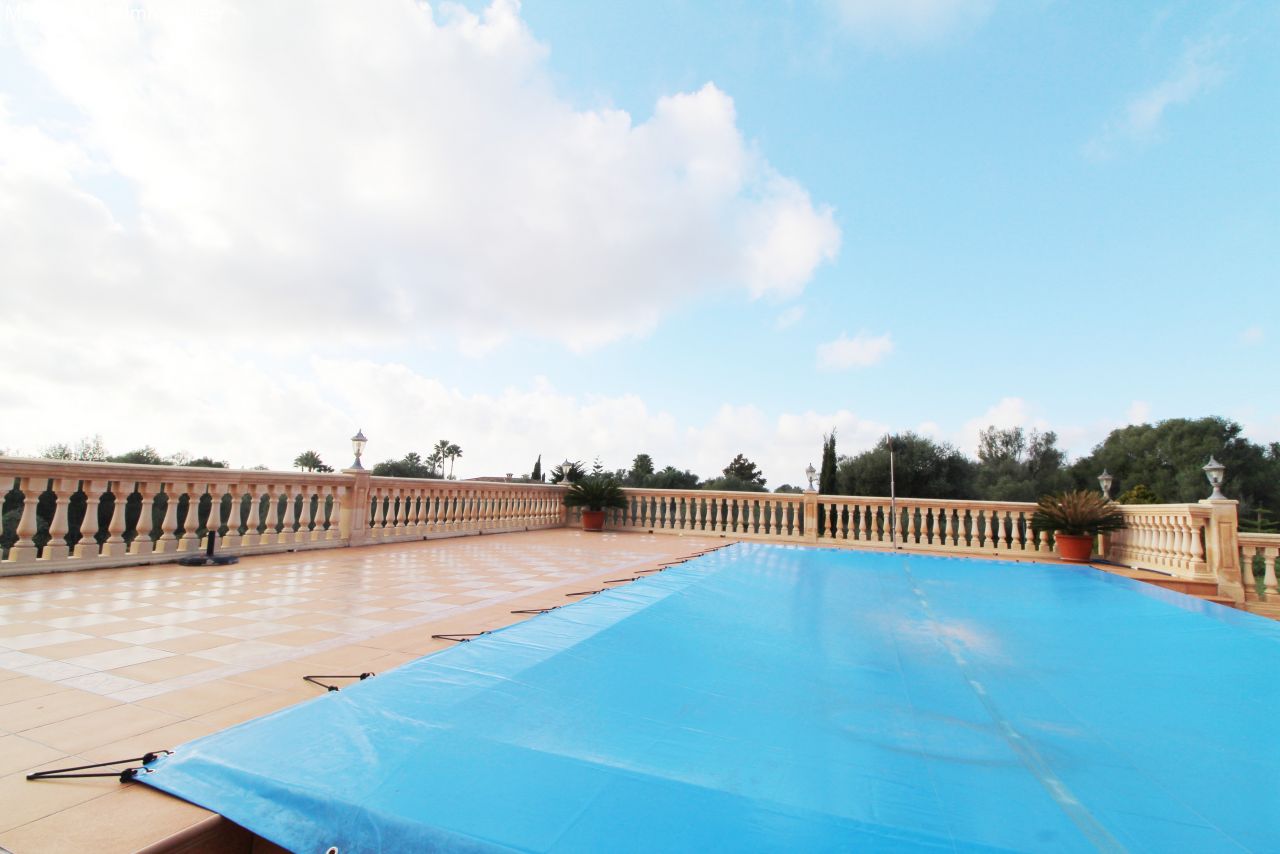 Exclusive pool terrace with elegant balustrade enclosure and spacious open area