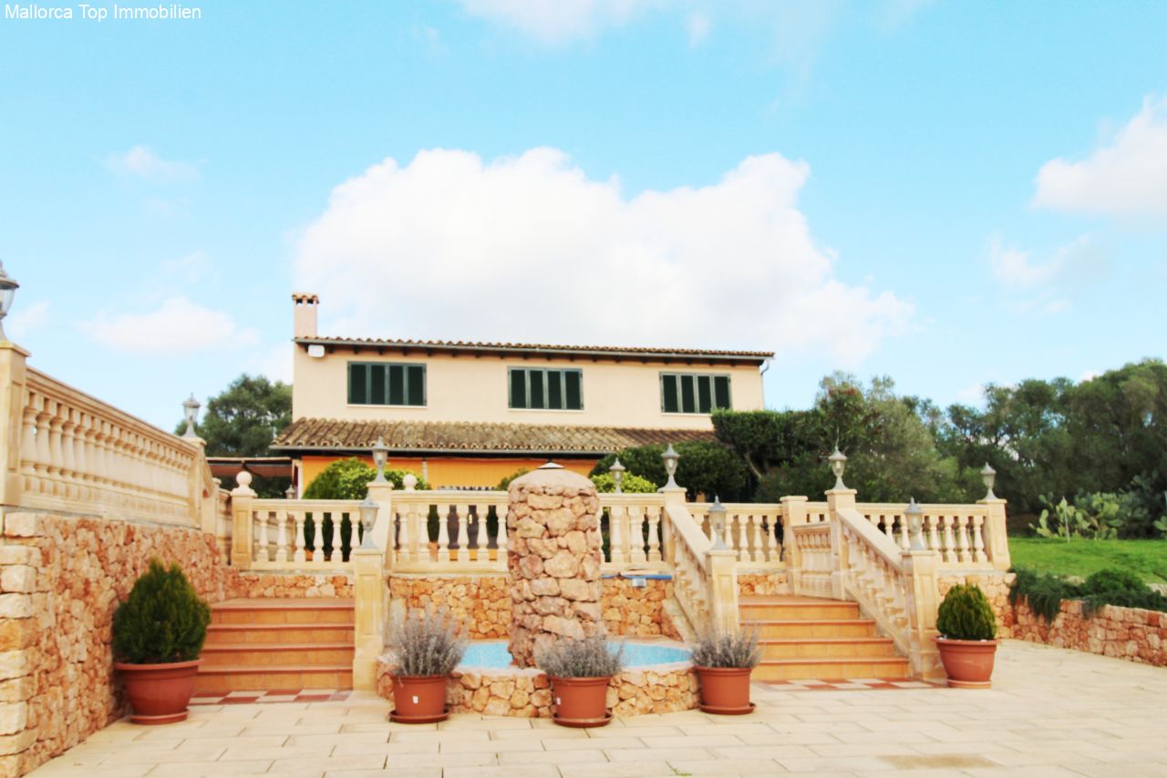 Mediterranean villa with an elegant natural stone terrace and balustrade enclosure