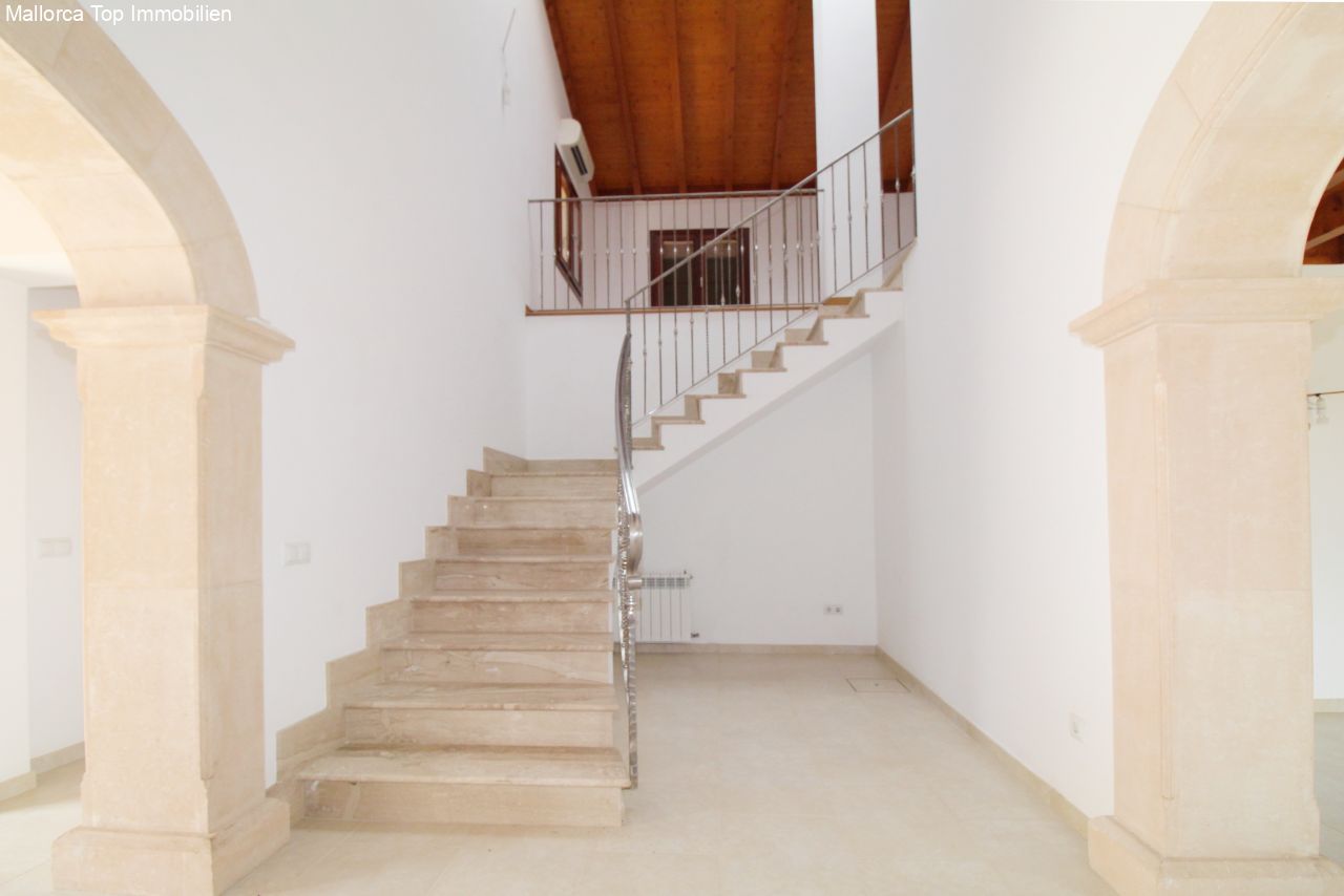 Elegant staircase with natural stone construction and modern metal railing