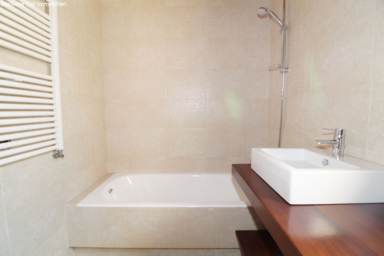 Modern bathroom with a walk-in bathtub and high-quality sanitary fittings