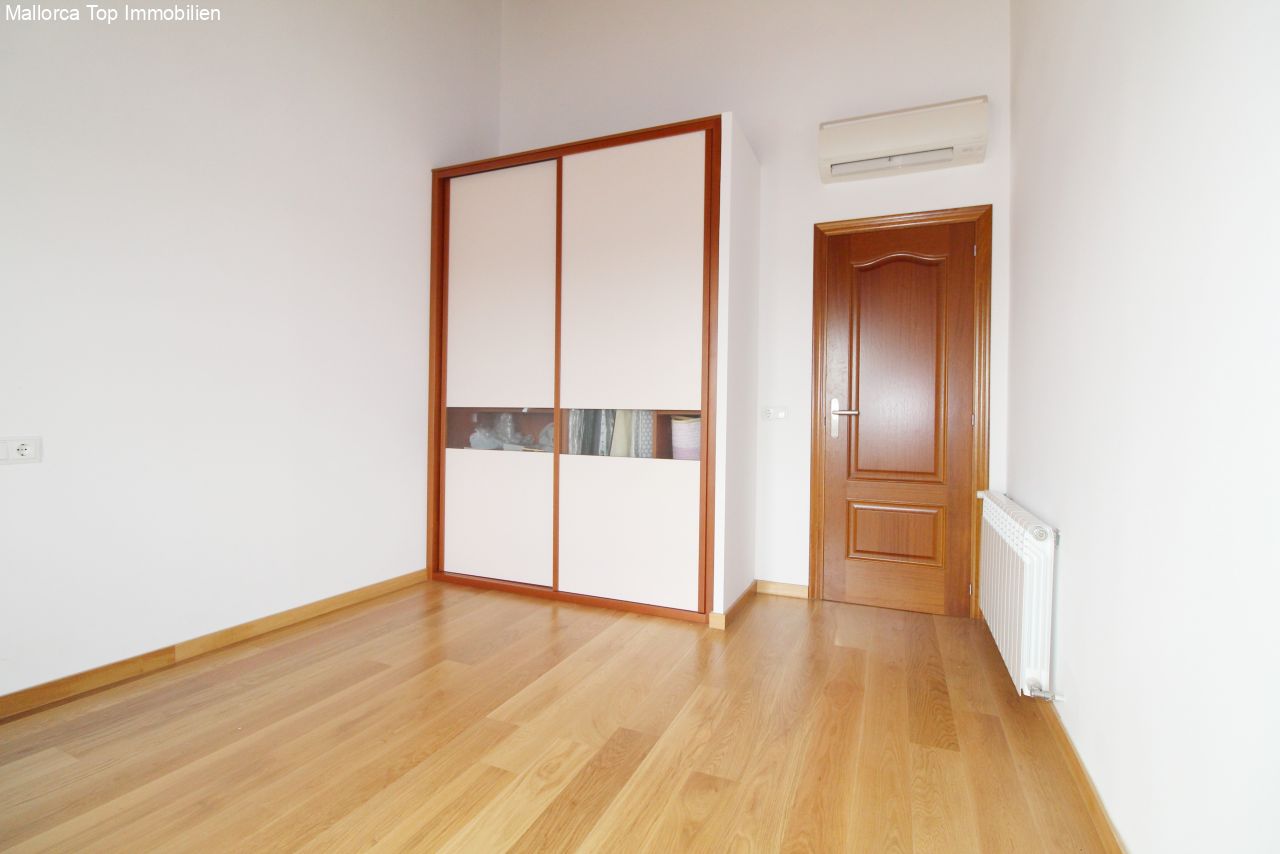 Comfortable bedroom with built-in wardrobe and air conditioning