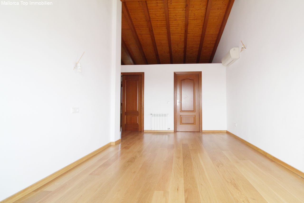 Elegant main room with a characterful wooden beam ceiling and flexible use of space