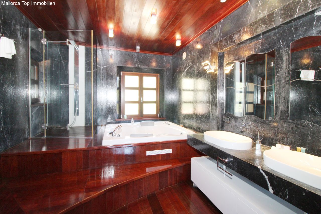 Luxurious bathroom with a walk-in shower, whirlpool bathtub, and double vanity. Luxurious bathroom with a walk-in shower, whirlpool bathtub, and double vanity.
