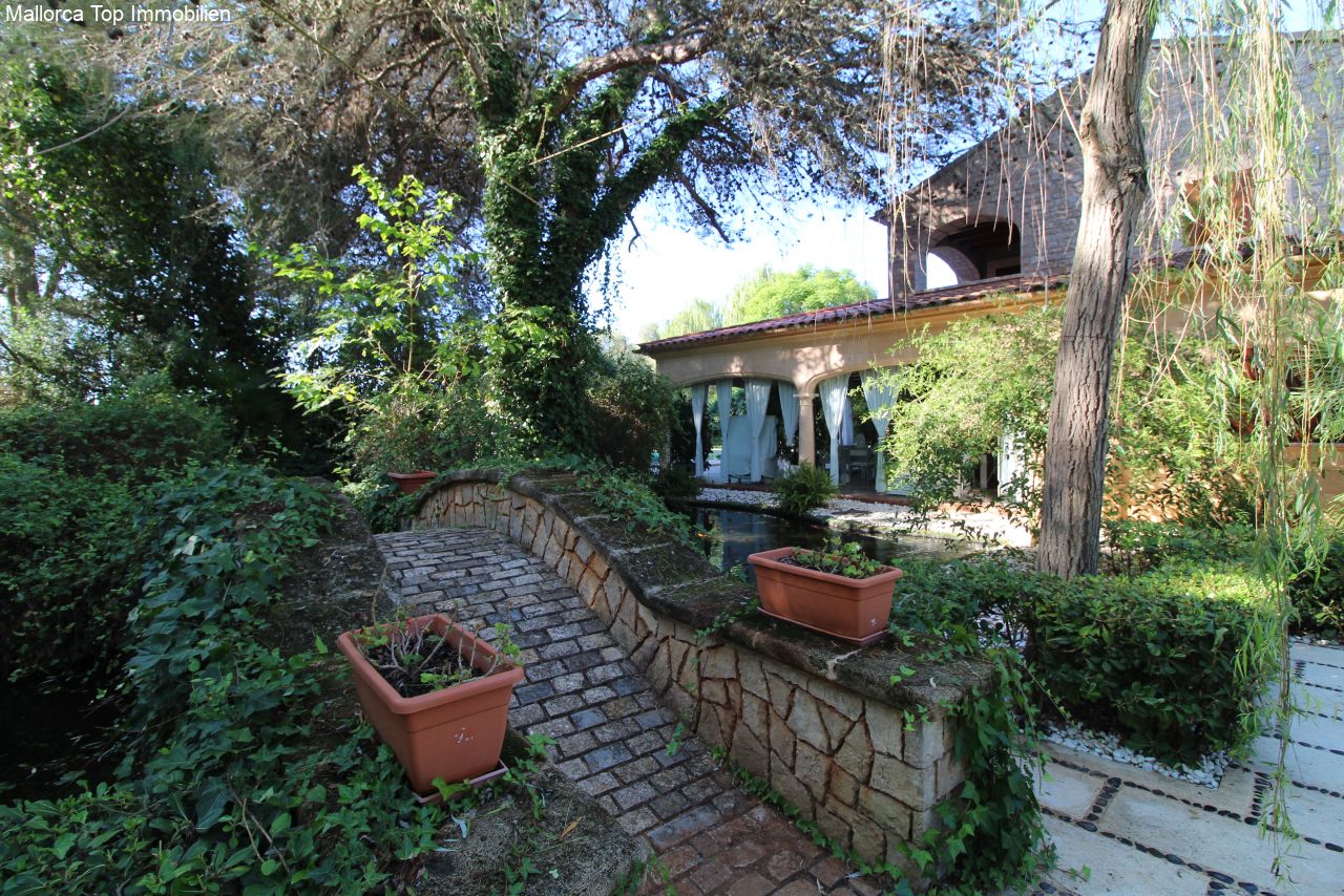 Romantic access path with authentic natural stone walls and old trees. Romantic access path with authentic natural stone walls and old trees.