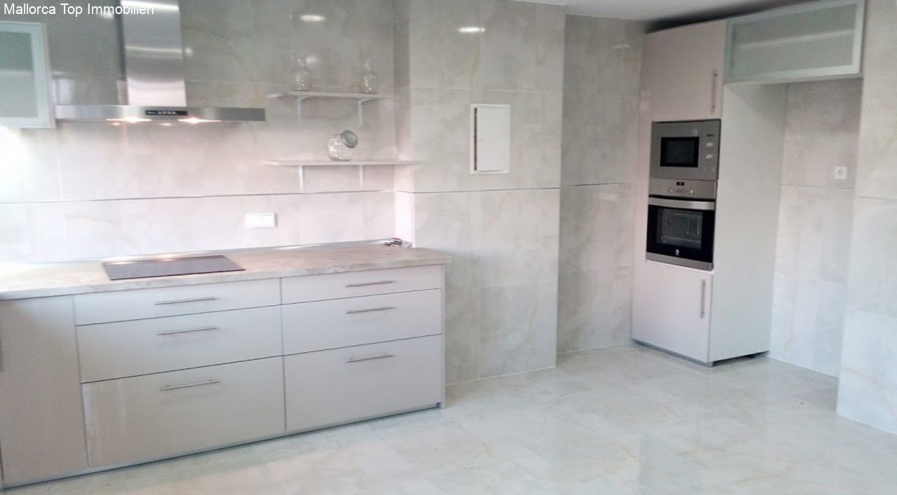 Modern kitchen with high-quality built-in appliances and optimal workspace Modern kitchen with high-quality built-in appliances and optimal workspace