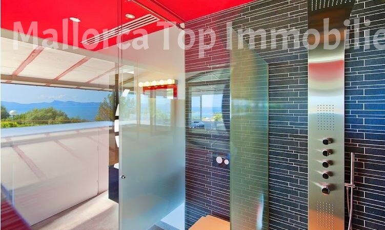 Modern bathroom with high-quality fittings and large glass surfaces Modern bathroom with high-quality fittings and large glass surfaces