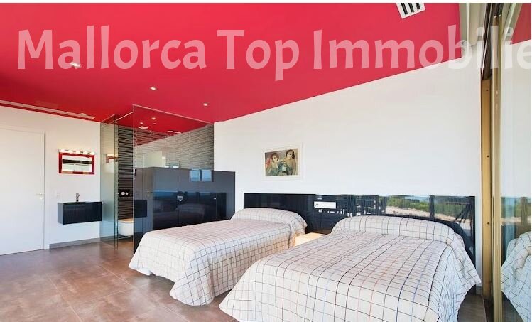 Comfortable double bedroom with integrated bathroom area and direct terrace access Comfortable double bedroom with integrated bathroom area and direct terrace access