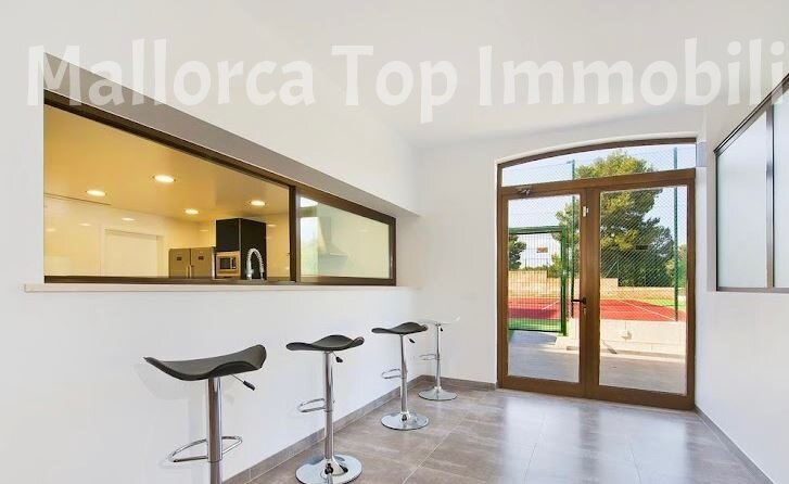 Modern kitchen bar with direct terrace access and high-quality glazing Modern kitchen bar with direct terrace access and high-quality glazing