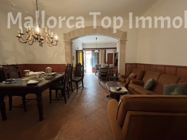 Open living and dining room with elegant connection and arched passage. Open living and dining room with elegant connection and arched passage.