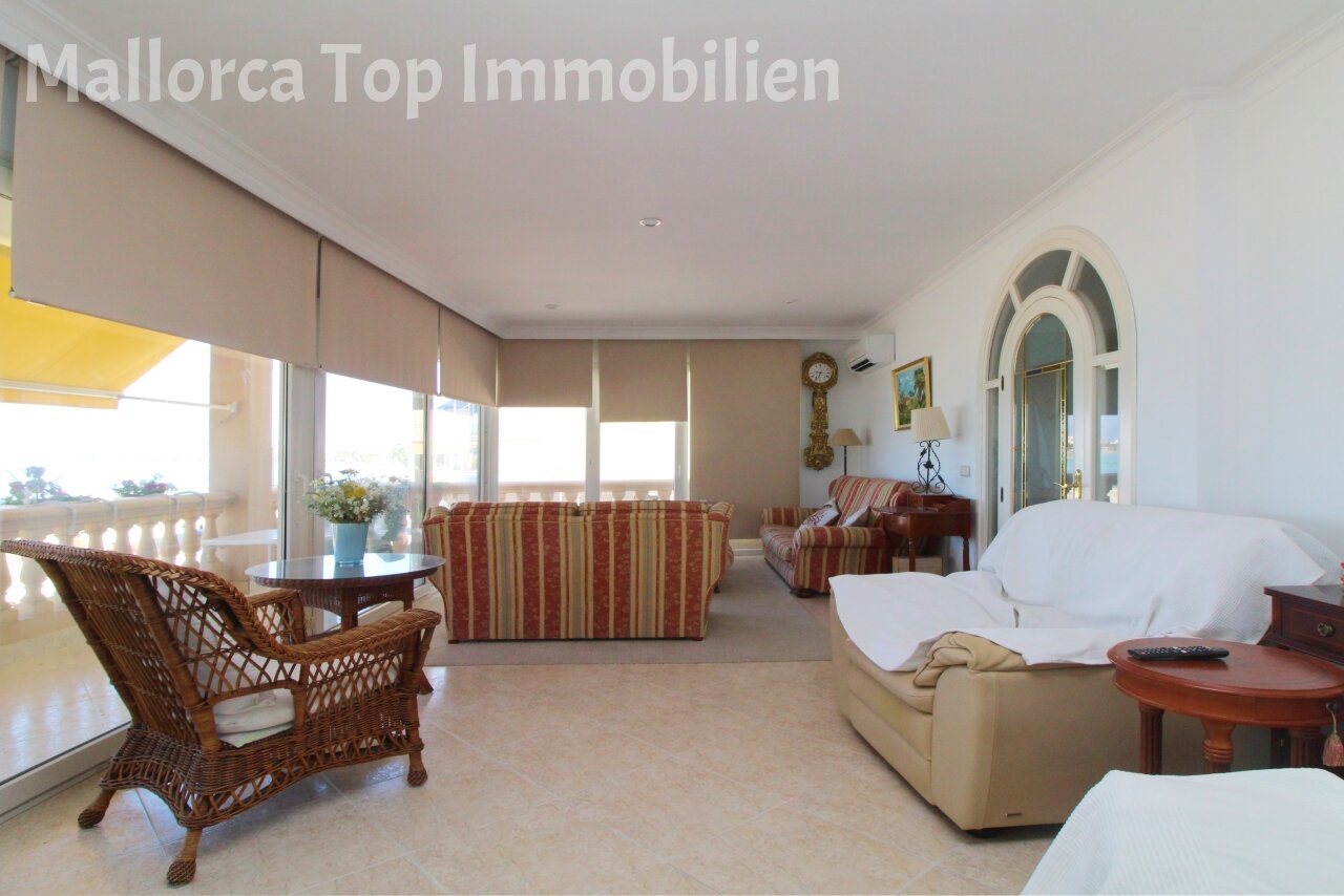 Bright living room with floor-to-ceiling windows and sea view Bright living room with floor-to-ceiling windows and sea view