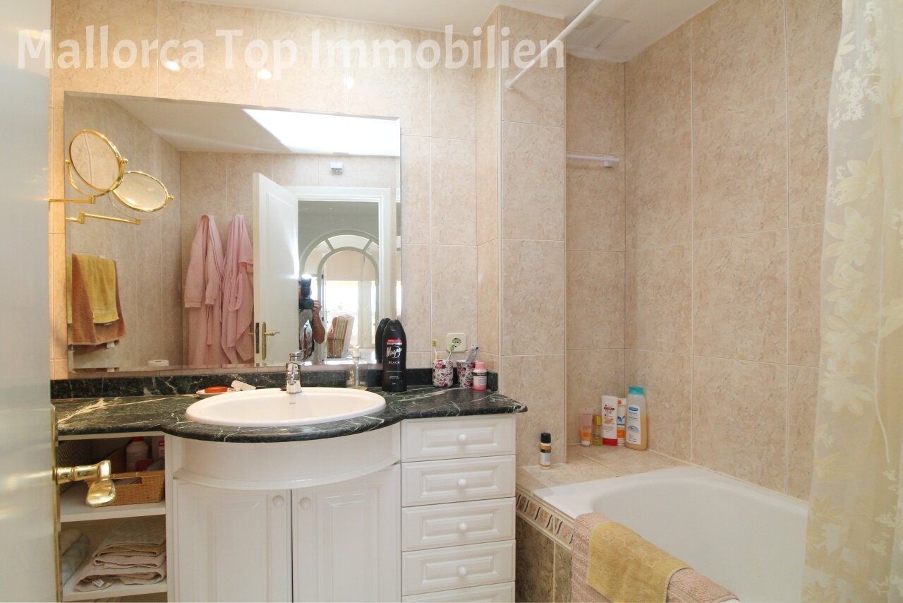Elegant bathroom with marble washbasin and walk-in shower Elegant bathroom with marble washbasin and walk-in shower