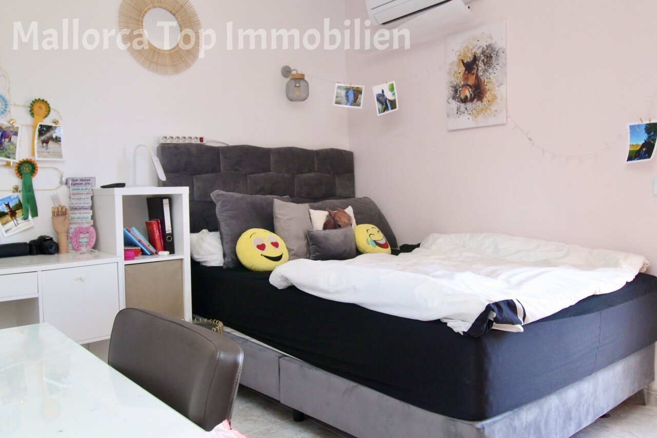 Bright bedroom with practical built-in wardrobe and air conditioning Bright bedroom with practical built-in wardrobe and air conditioning