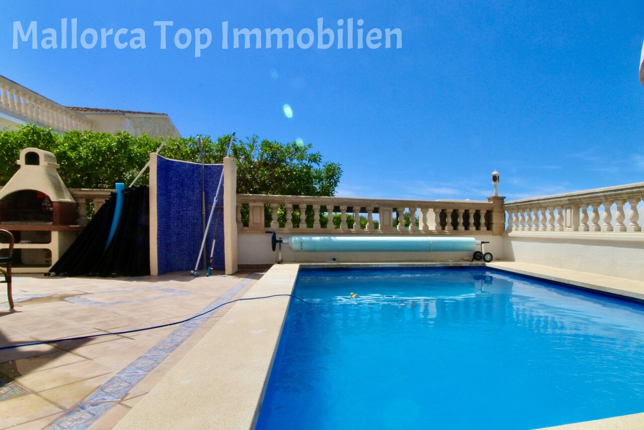 Luxurious pool area with automatic cover system and elegant balustrade Luxurious pool area with automatic cover system and elegant balustrade