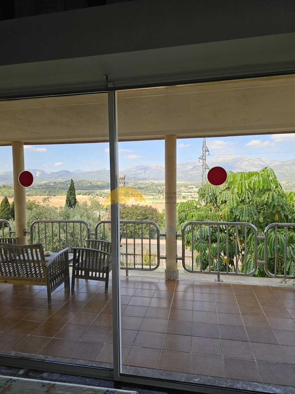 Terrace area with panoramic glazing and panoramic view of the mountain landscape Terrace area with panoramic glazing and panoramic view of the mountain landscape