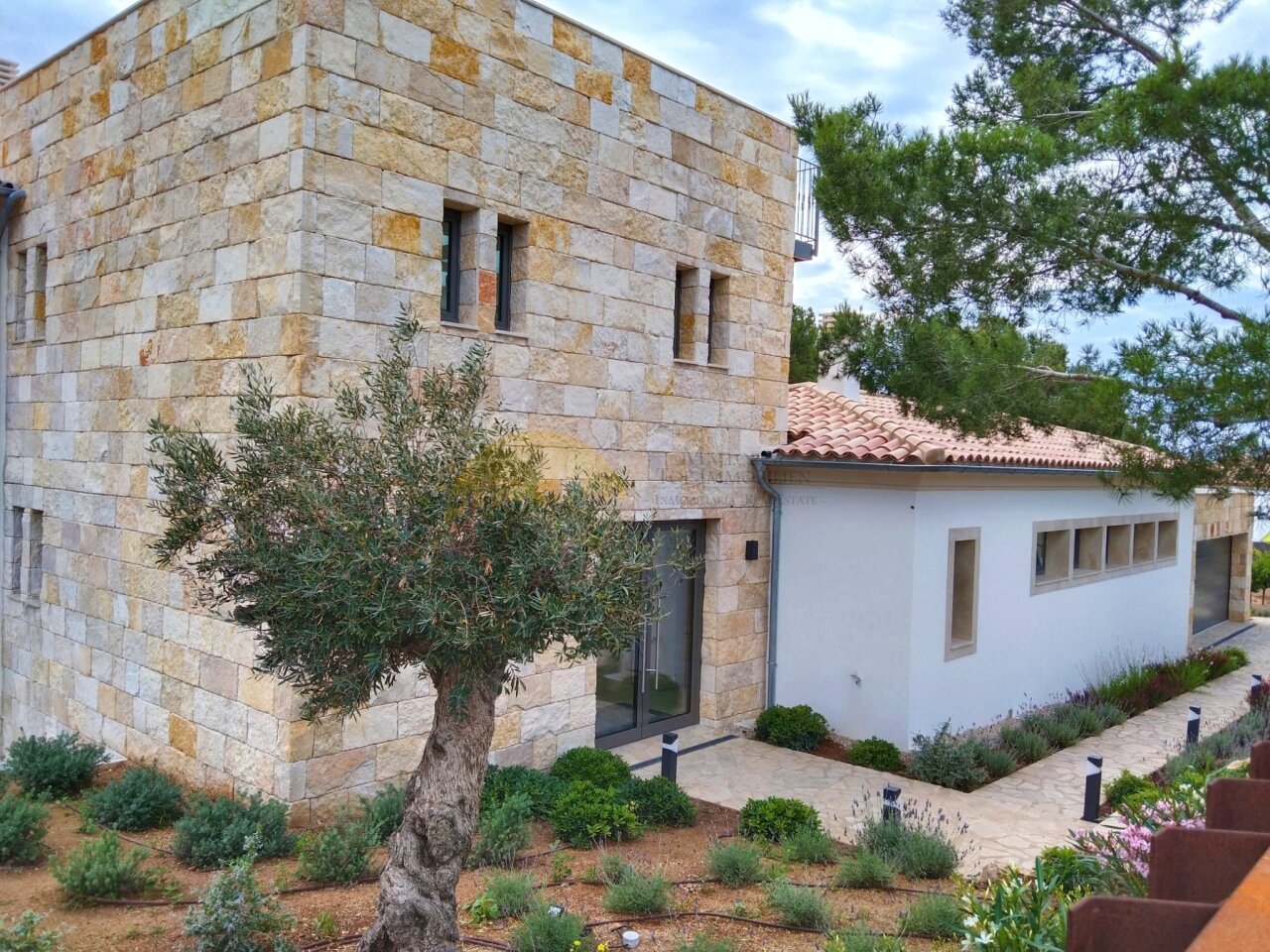 Architectural masterpiece with distinctive natural stone masonry and modern extension Architectural masterpiece with distinctive natural stone masonry and modern extension