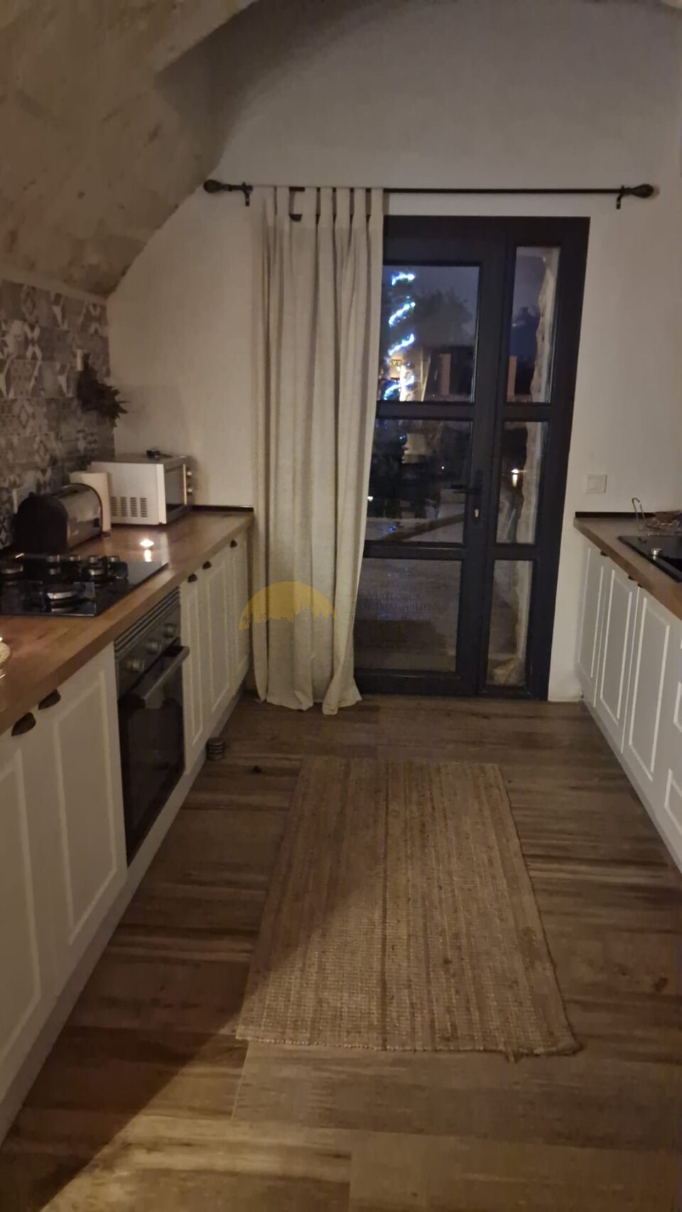 Kitchen with direct access to the terrace and practical work surface Kitchen with direct access to the terrace and practical work surface