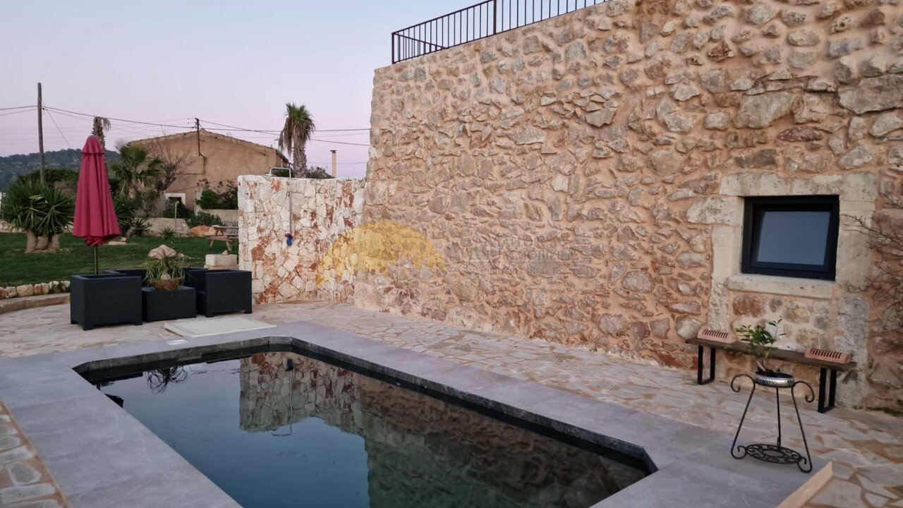 Pool area with authentic natural stone walls and covered terrace Pool area with authentic natural stone walls and covered terrace