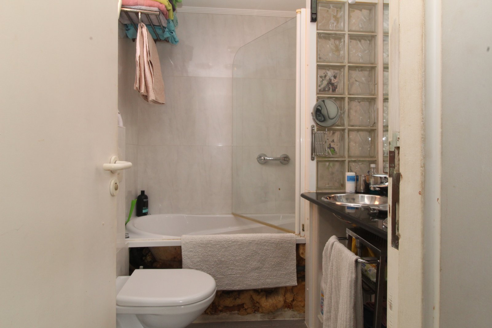 Functional bathroom with practical amenities and shower/bathtub combination Functional bathroom with practical amenities and shower/bathtub combination