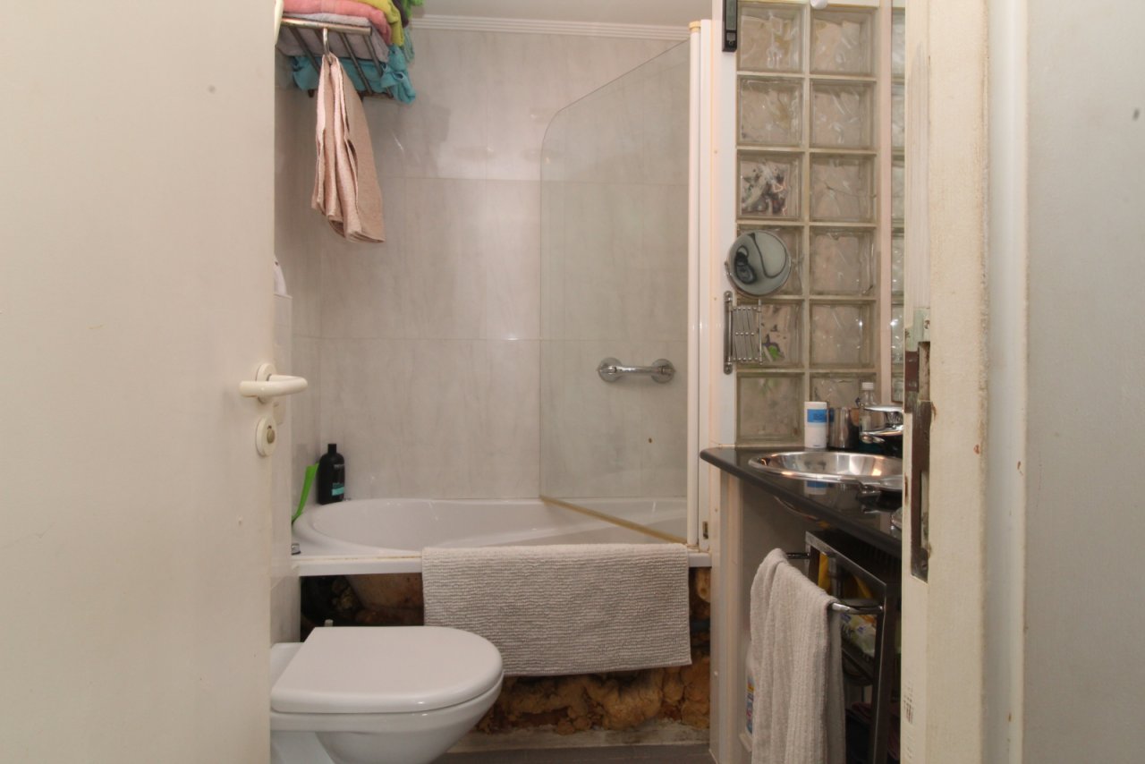 Functional bathroom with practical amenities and shower/bathtub combination Functional bathroom with practical amenities and shower/bathtub combination