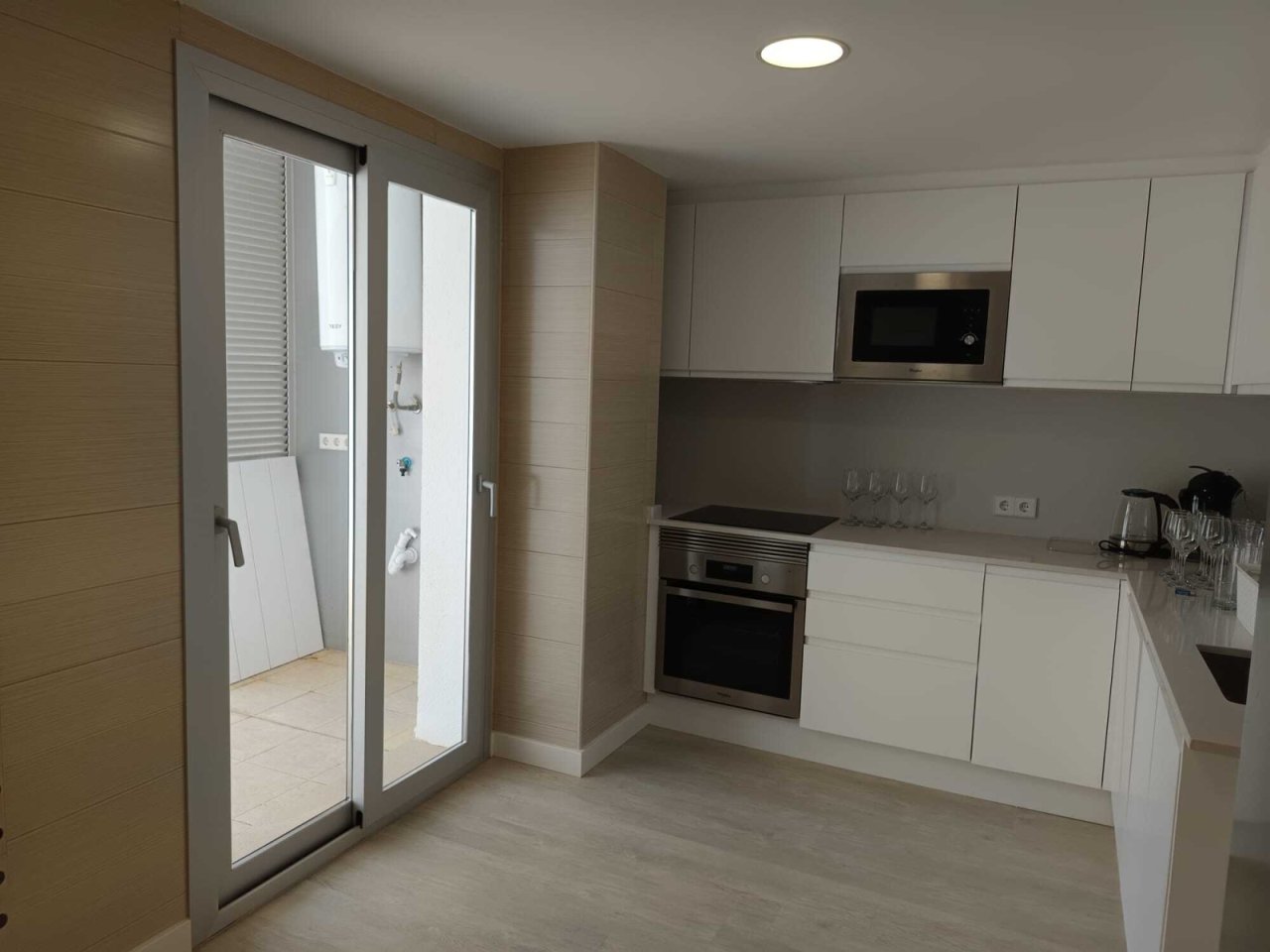 Modern kitchen with premium appliances and ergonomic L-shaped layout Modern kitchen with premium appliances and ergonomic L-shaped layout