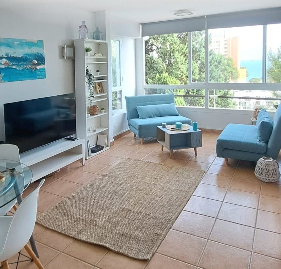 Bright living room with large glass surfaces and direct balcony access – perfect for open living Bright living room with large glass surfaces and direct balcony access – perfect for open living
